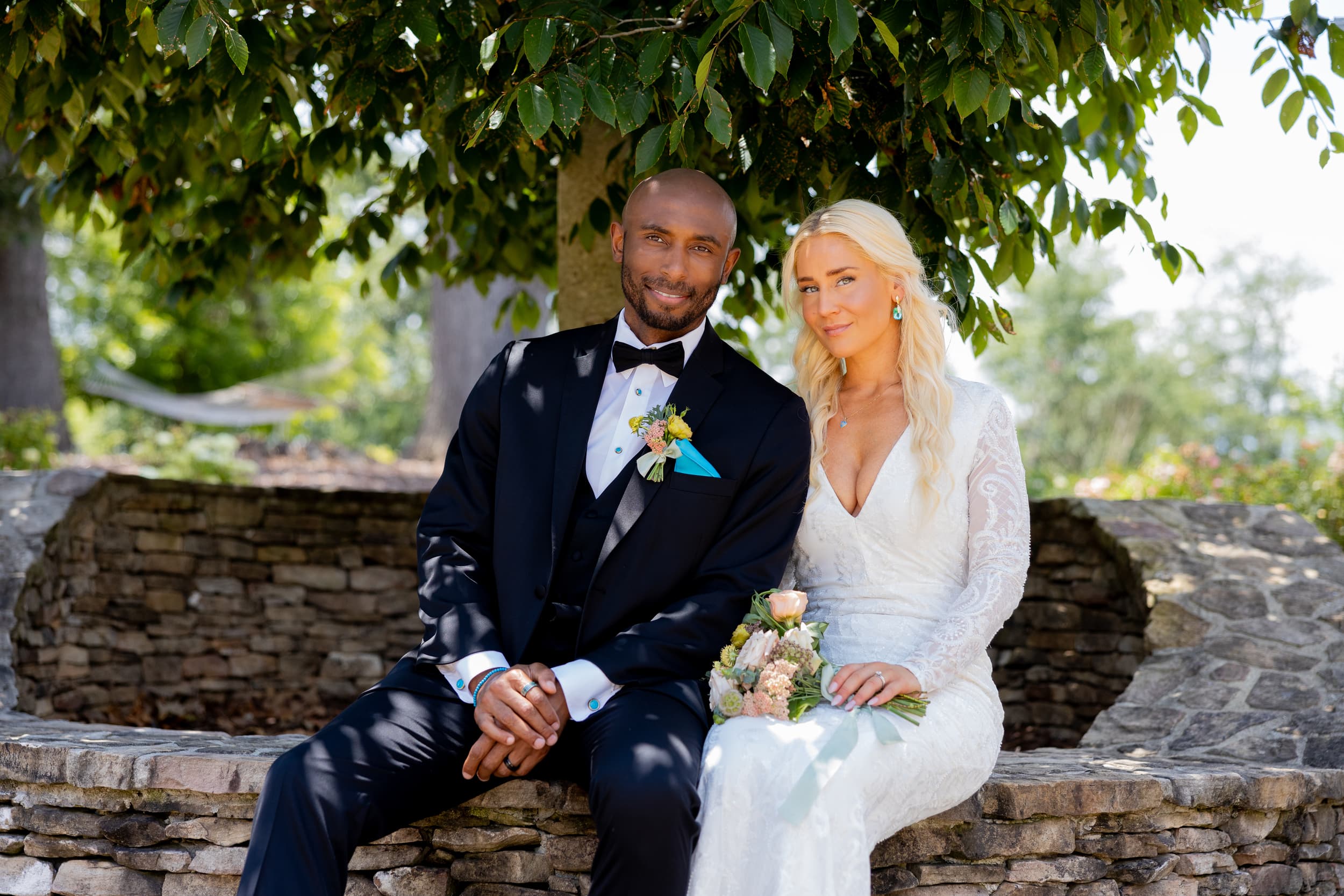 Kary and Taniye Youman together outdoors on their wedding day.